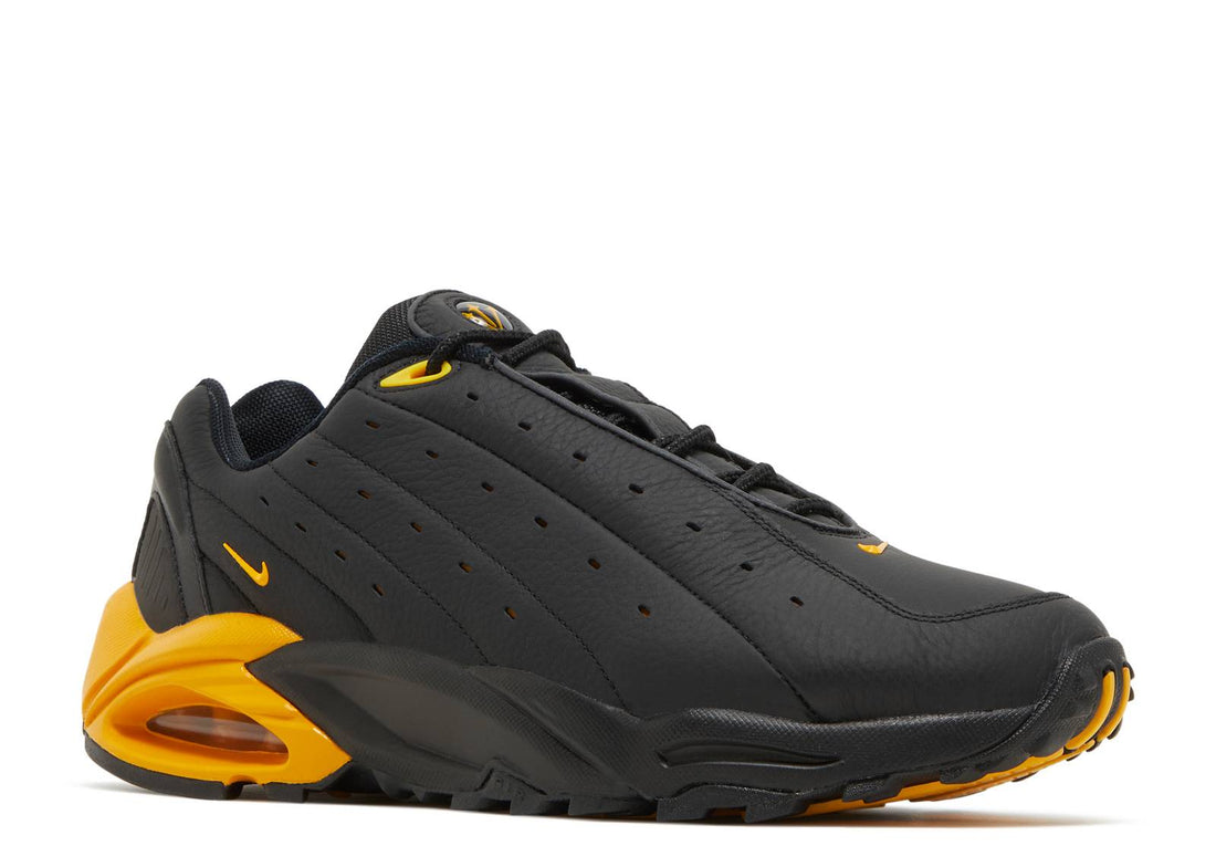 NOCTA x Nike Hot Step Air Terra "Black/University Gold"