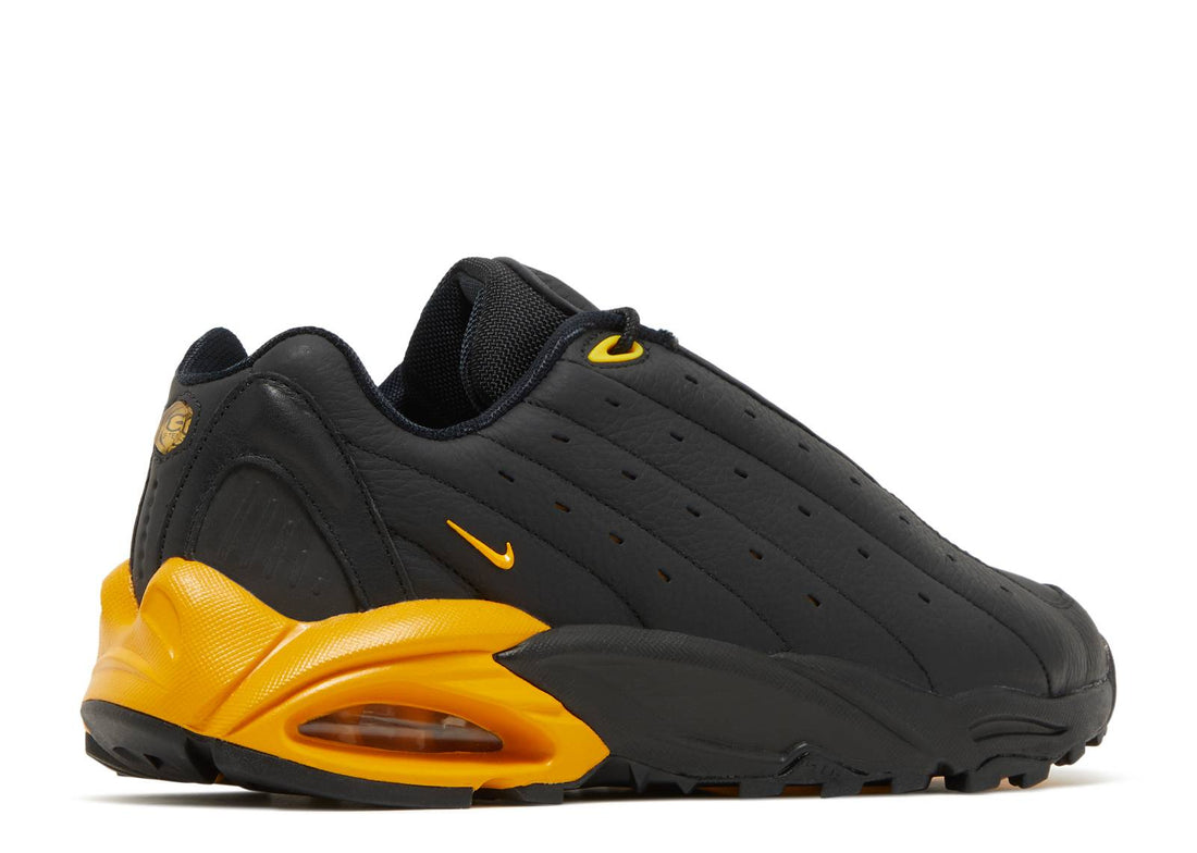 NOCTA x Nike Hot Step Air Terra "Black/University Gold"